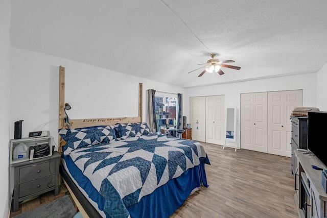 1020 SW 3rd St, Nevada, IA 50201 - bedroom featuring two closets, wood finished floors, and a ceiling fan