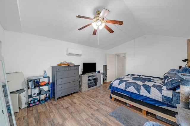 1020 SW 3rd St, Nevada, IA 50201 - bedroom with lofted ceiling, a wall mounted air conditioner, light wood finished floors, and ceiling fan