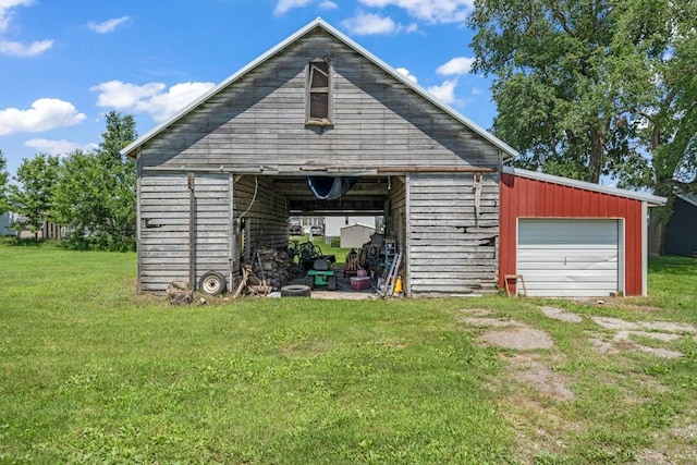 1020 SW 3rd St, Nevada, IA 50201 - view of pole building with a lawn