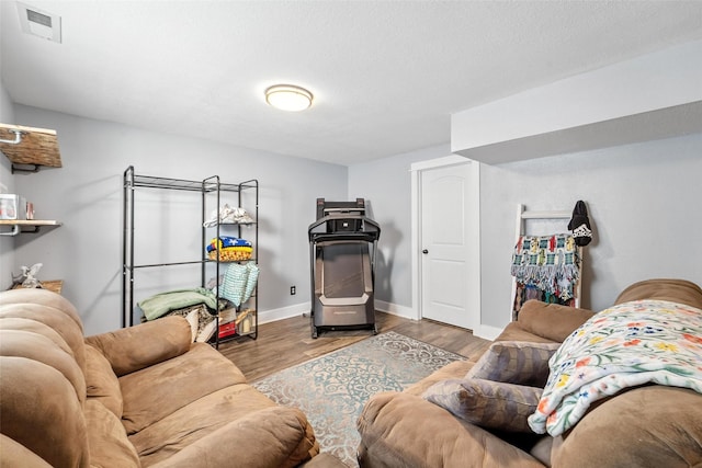 3504 Hawthorn Dr SW, Bondurant, IA 50035 - living area featuring wood finished floors and baseboards
