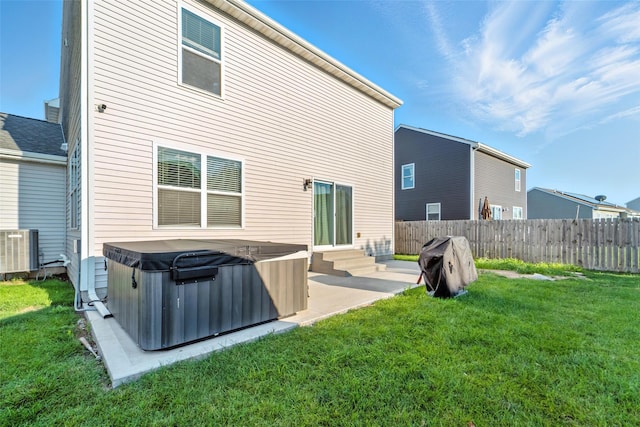 3504 Hawthorn Dr SW, Bondurant, IA 50035 - rear view of house featuring a hot tub, a patio, and entry steps