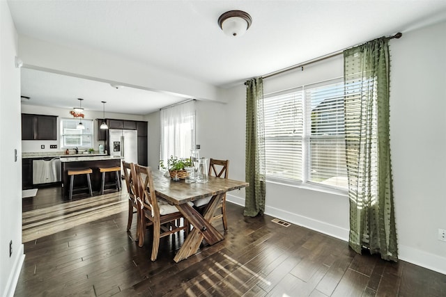 3504 Hawthorn Dr SW, Bondurant, IA 50035 - dining room with dark wood-style flooring