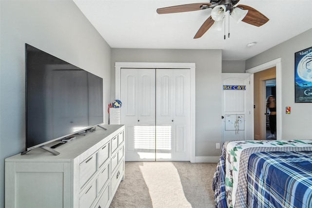3504 Hawthorn Dr SW, Bondurant, IA 50035 - bedroom with light carpet, a closet, and ceiling fan