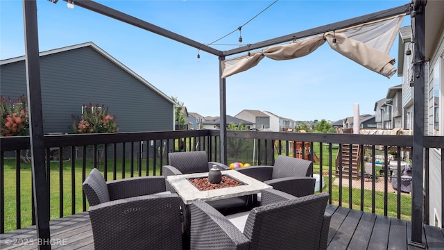1208 NE 21st St, Grimes, IA 50111 - wooden deck with a fire pit, a residential view, and a yard