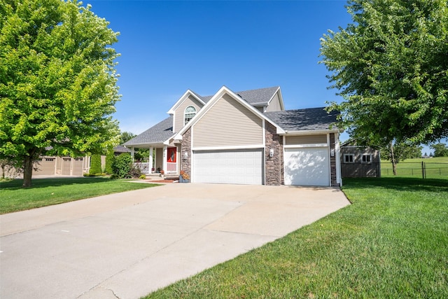 4785 Windsor Cir, Pleasant Hill, IA 50327 - traditional-style house with an attached garage, concrete driveway, roof with shingles, and stone siding