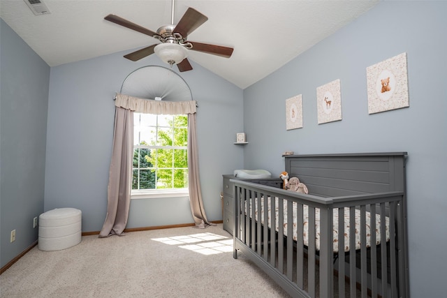 4785 Windsor Cir, Pleasant Hill, IA 50327 - bedroom with a crib, vaulted ceiling, carpet, and a ceiling fan