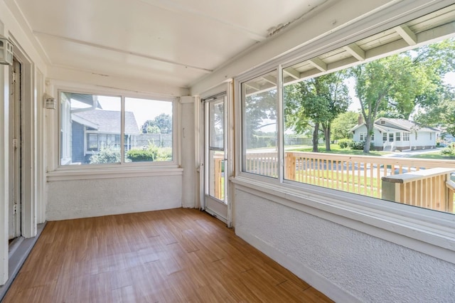 849 39th St, Des Moines, IA 50312 - unfurnished sunroom featuring a textured wall and wood finished floors