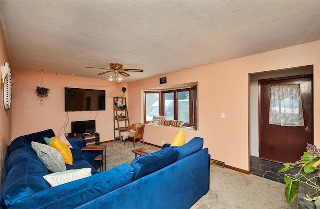1612 Horse N Buggy Dr, Adel, IA 50003 - carpeted living area featuring a ceiling fan and a textured ceiling