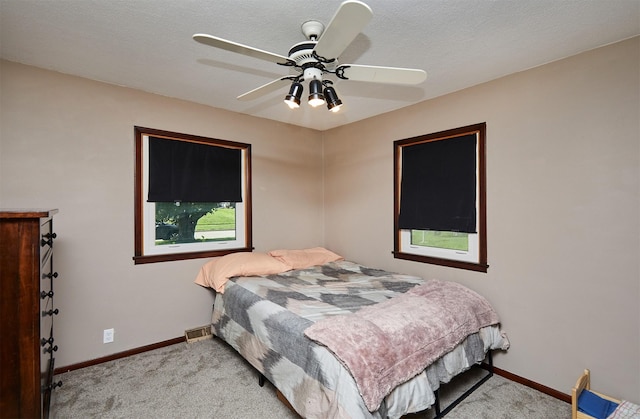 1612 Horse N Buggy Dr, Adel, IA 50003 - carpeted bedroom with baseboards and a ceiling fan