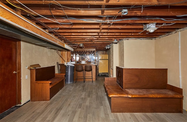 1612 Horse N Buggy Dr, Adel, IA 50003 - unfinished basement with wood finished floors and a bar