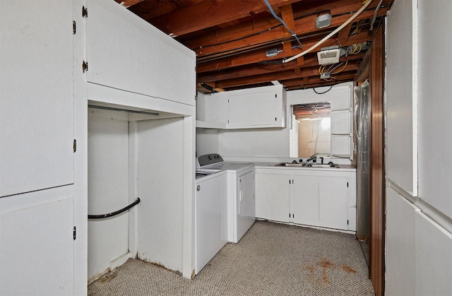 1612 Horse N Buggy Dr, Adel, IA 50003 - washroom with cabinet space, washer and clothes dryer, and light carpet