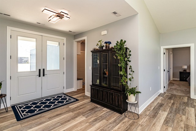409 S St, Jewell, IA 50130 - foyer featuring light wood-style floors and french doors
