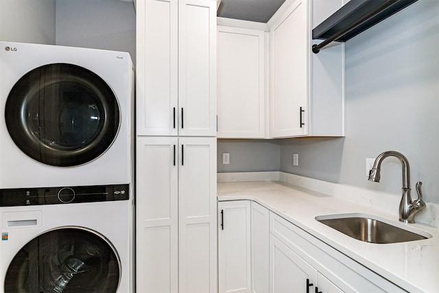 409 S St, Jewell, IA 50130 - washroom featuring stacked washer / dryer and cabinet space