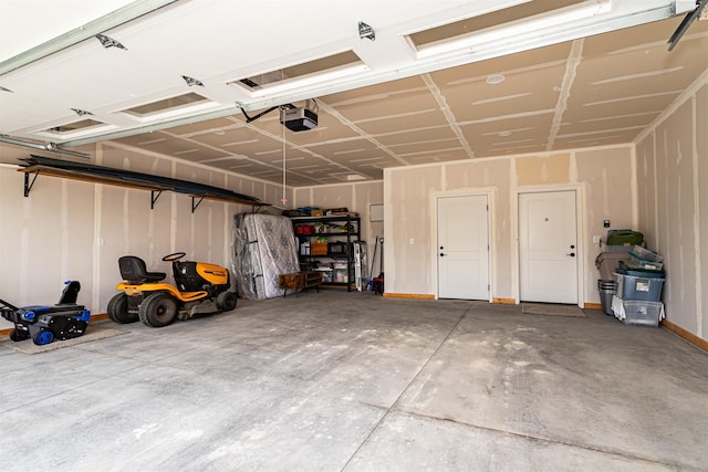 409 S St, Jewell, IA 50130 - garage featuring a garage door opener