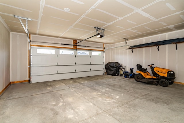 409 S St, Jewell, IA 50130 - garage with a garage door opener and baseboards