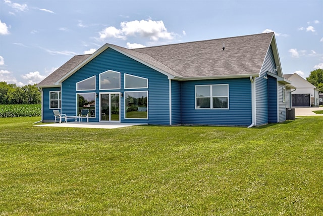 409 S St, Jewell, IA 50130 - rear view of property with roof with shingles, a lawn, and a patio