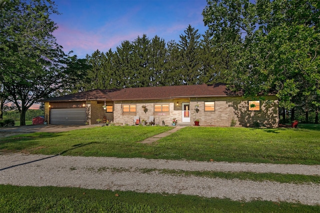 122 G76 Hwy, Lacona, IA 50139 - ranch-style home with a garage, driveway, and a front yard