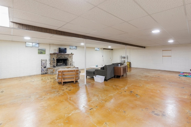 122 G76 Hwy, Lacona, IA 50139 - finished below grade area featuring a drop ceiling and a fireplace