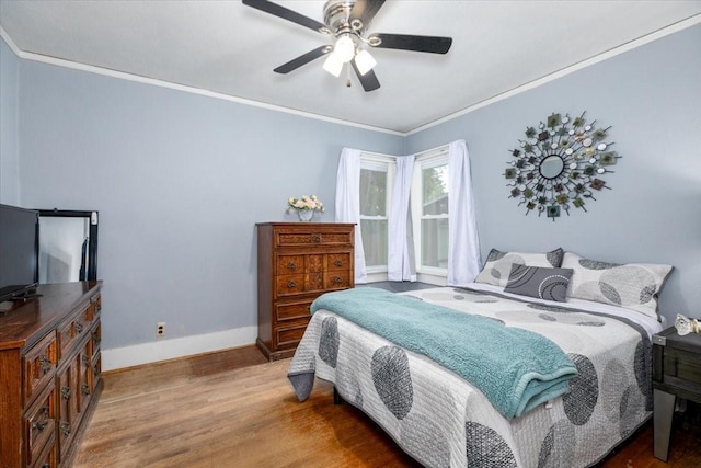 616 4th St, West Des Moines, IA 50265 - bedroom featuring wood finished floors, crown molding, and a ceiling fan