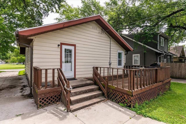 616 4th St, West Des Moines, IA 50265 - back of house featuring a wooden deck