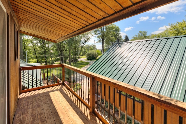 702 Jasper Ave NE, Mitchellville, IA 50169 - wooden terrace with view of scattered trees