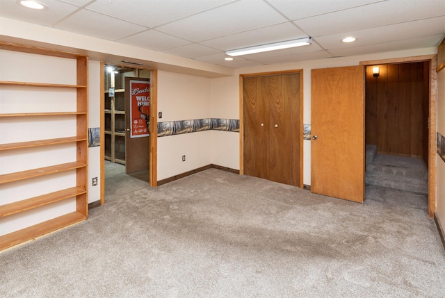 702 Jasper Ave NE, Mitchellville, IA 50169 - finished below grade area with carpet, a drop ceiling, and recessed lighting