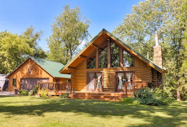 702 Jasper Ave NE, Mitchellville, IA 50169 - back of house with log siding, a lawn, a chimney, and french doors