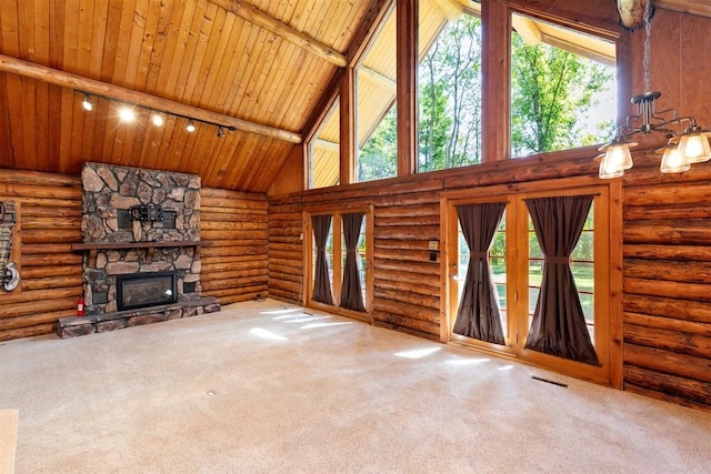 702 Jasper Ave NE, Mitchellville, IA 50169 - unfurnished living room with high vaulted ceiling, a wooden ceiling with exposed beams, carpet, a fireplace, and track lighting