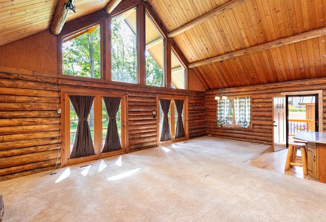 702 Jasper Ave NE, Mitchellville, IA 50169 - unfurnished living room featuring high vaulted ceiling, carpet flooring, a wood ceiling with exposed beams, and log walls