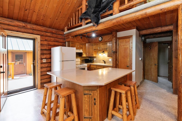 702 Jasper Ave NE, Mitchellville, IA 50169 - kitchen with white appliances, log walls, brown cabinetry, light countertops, and a breakfast bar
