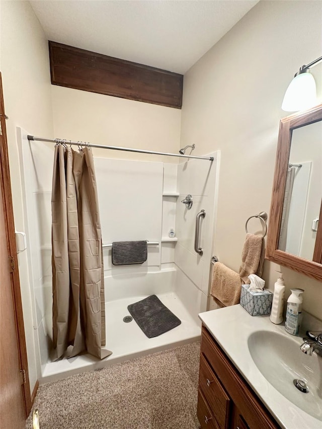 94 14th Ave, Grinnell, IA 50112 - bathroom featuring a shower stall and vanity