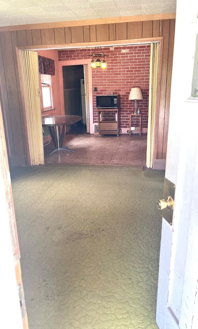 1348 Idaho St, Des Moines, IA 50316 - corridor with wooden walls and carpet