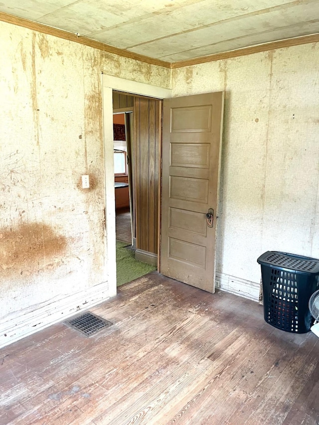 1348 Idaho St, Des Moines, IA 50316 - unfurnished room with wood finished floors and ornamental molding
