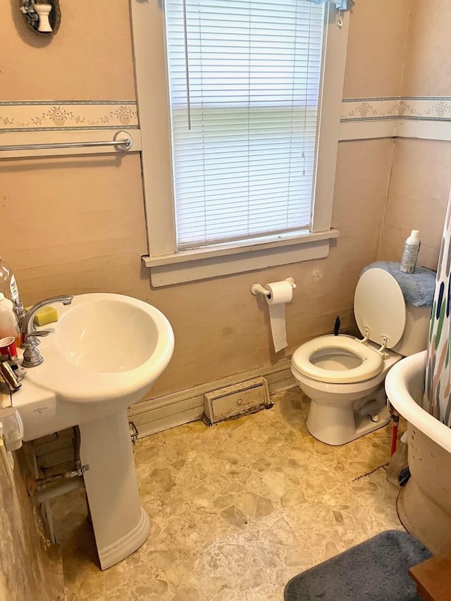 1348 Idaho St, Des Moines, IA 50316 - bathroom with a bathtub and toilet