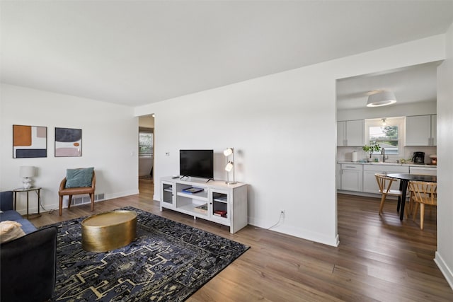 3025 Dean Ave, Des Moines, IA 50317 - living area with wood finished floors and baseboards