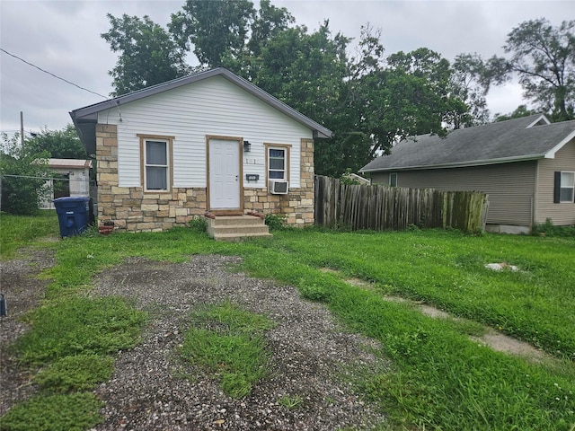 1517 Delaware Ave, Des Moines, IA 50317 - bungalow-style house featuring stone siding and cooling unit