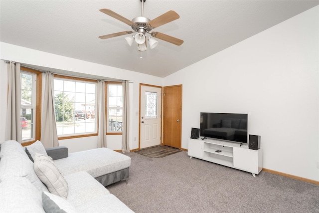 6217 Welker Ave, Des Moines, IA 50312 - living area with carpet floors, lofted ceiling, and a ceiling fan