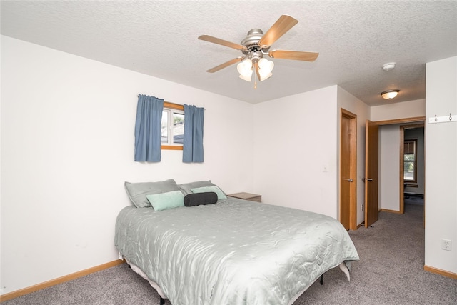 6217 Welker Ave, Des Moines, IA 50312 - carpeted bedroom featuring a textured ceiling and ceiling fan