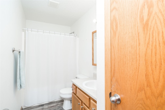 6217 Welker Ave, Des Moines, IA 50312 - bathroom with vanity and wood finished floors