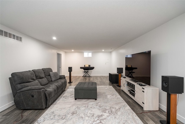 6217 Welker Ave, Des Moines, IA 50312 - living room featuring dark wood-style floors and recessed lighting