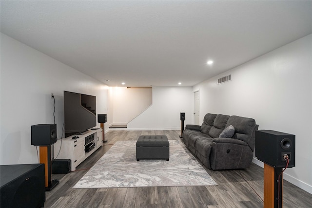 6217 Welker Ave, Des Moines, IA 50312 - living room with wood finished floors, recessed lighting, and stairs