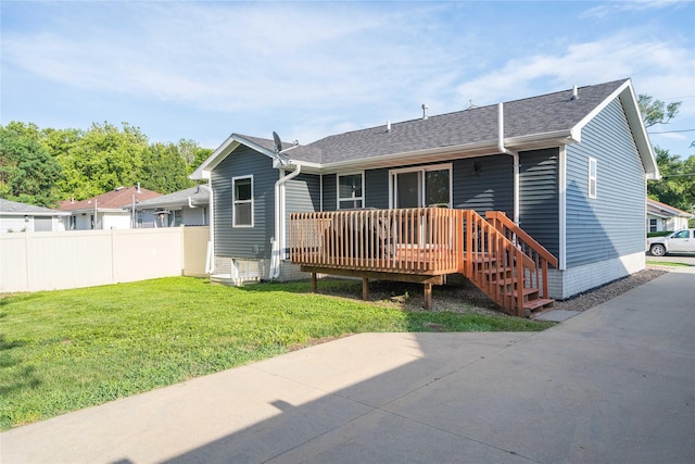 6217 Welker Ave, Des Moines, IA 50312 - back of house with a wooden deck and a shingled roof