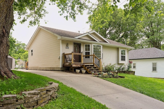 221 E Payton Ave, Des Moines, IA 50315 - single story home with driveway, a front lawn, and a shingled roof
