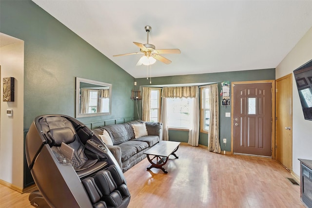 221 E Payton Ave, Des Moines, IA 50315 - living area featuring lofted ceiling, light wood finished floors, a ceiling fan, and healthy amount of natural light