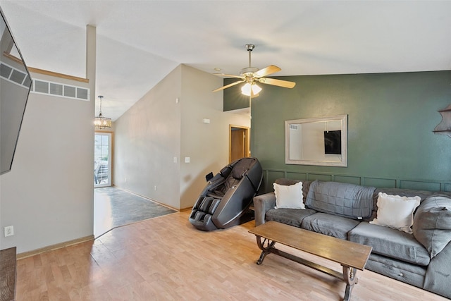 221 E Payton Ave, Des Moines, IA 50315 - living area with wood finished floors, a ceiling fan, and high vaulted ceiling