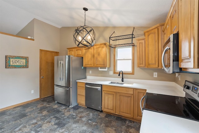 221 E Payton Ave, Des Moines, IA 50315 - kitchen featuring stainless steel appliances, vaulted ceiling, light countertops, decorative light fixtures, and a chandelier