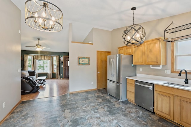 221 E Payton Ave, Des Moines, IA 50315 - kitchen featuring stainless steel appliances, light countertops, high vaulted ceiling, a chandelier, and a ceiling fan