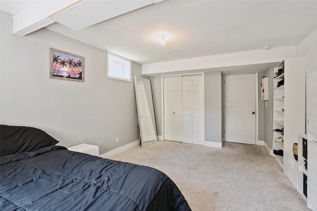 221 E Payton Ave, Des Moines, IA 50315 - bedroom with light colored carpet and a closet