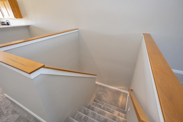 1102 Westview Dr, Huxley, IA 50124 - staircase featuring carpet and baseboards