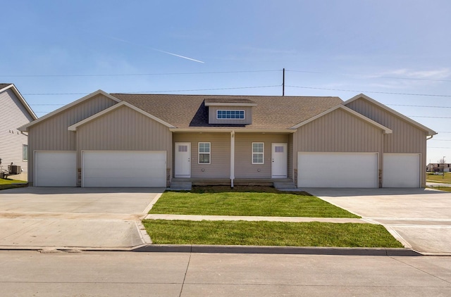 1102 Westview Dr, Huxley, IA 50124 - view of front facade with a garage, driveway, and a shingled roof